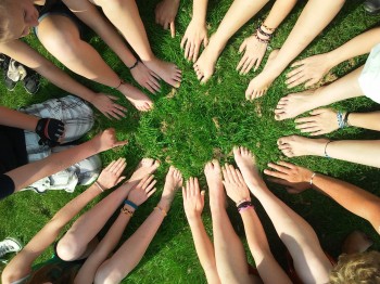 Hand and foot mandala on grass