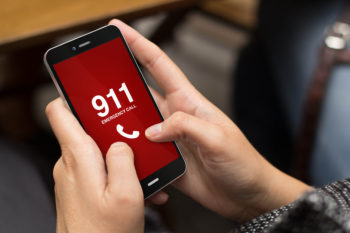 Girl using cell phone to call 911