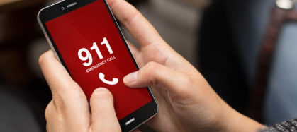 Girl using cell phone to call 911
