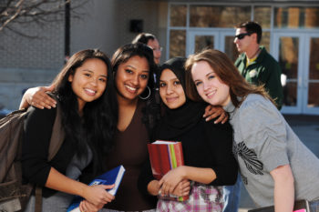 Group of diverse college students posing for photograph